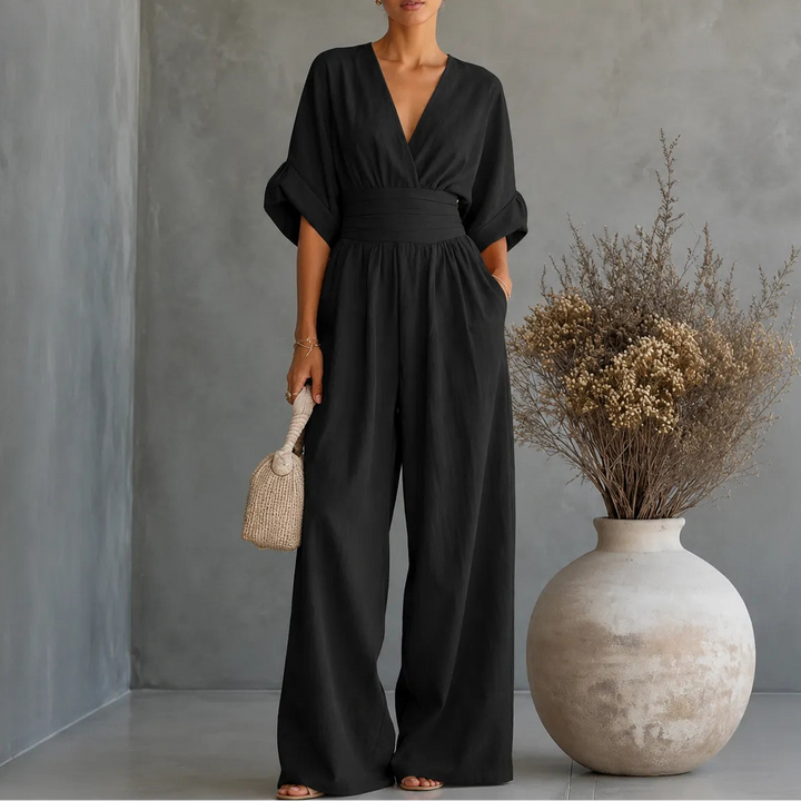 Soléra – Wide Leg V Neck Jumpsuit with Pleated Waist Sash