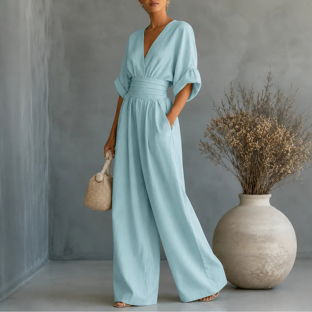 Soléra – Wide Leg V Neck Jumpsuit with Pleated Waist Sash